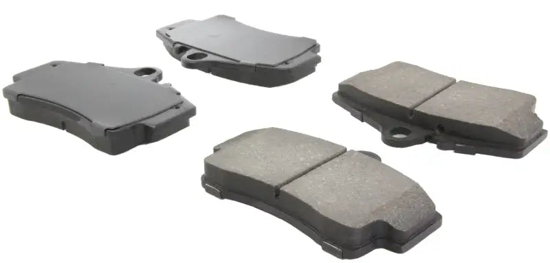 Four StopTech Performance rear brake pads for Porsche Boxster and 911 models