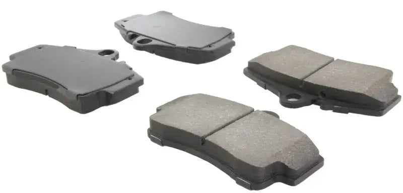 Four StopTech Performance rear brake pads for Porsche Boxster and 911 models