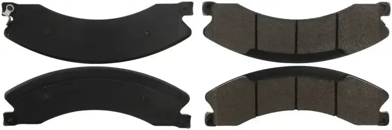 Four black StopTech Street Brake Pads with curved segmented design for front braking