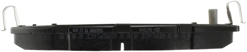 Black plastic bait station with metal hooks for StopTech Street Brake Pads rear install