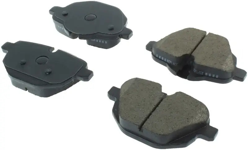 Four dark grey and black StopTech Street Brake Pads for rear brake system