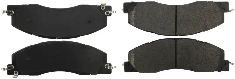Four StopTech Street Brake Pads with backing plates and friction material for rear brake upgrade