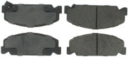 Four StopTech Street Select rear brake pads for improved braking performance