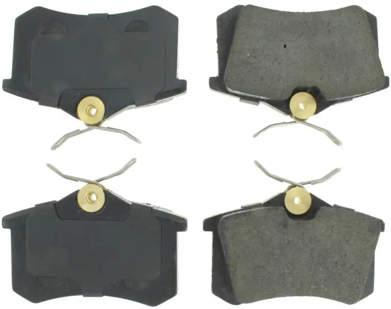 Four StopTech Street Select brake pads with springs for rear brake upgrade