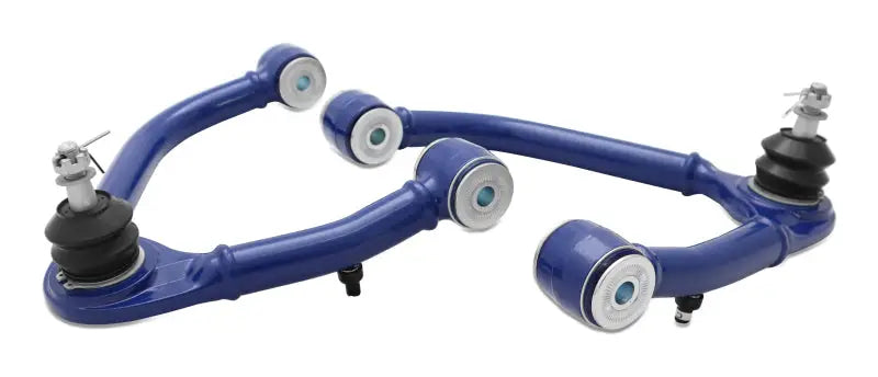 SuperPro blue upper control arm set for Chevrolet Silverado and GMC Sierra with white bushings