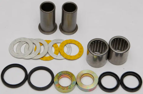 Assortment of metal and rubber parts for Swingarm Bearing Kit, perfect for bearing kit needs