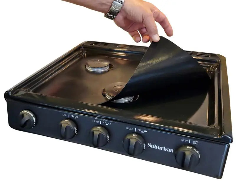 SWRV400 Stove Wrap Stove Top Protectors Suburban being placed on a stove to keep it clean and scratch-free.