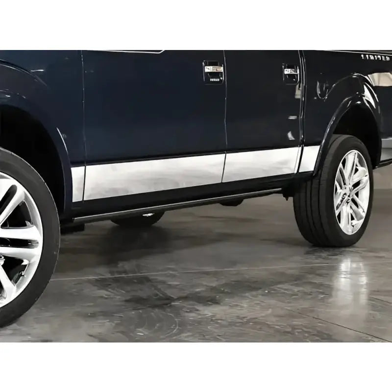 Dark blue Ford F-150 with chrome door trim and running boards showcasing ici stainles rocker panels