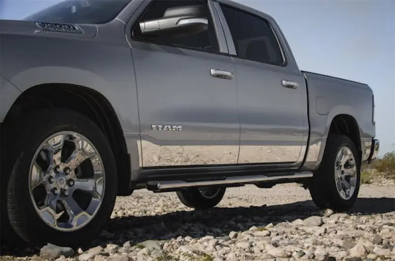 Silver four-door pickup truck with chrome accents and rocker panels for T3058-304M Ici Stainles Rocker Panels