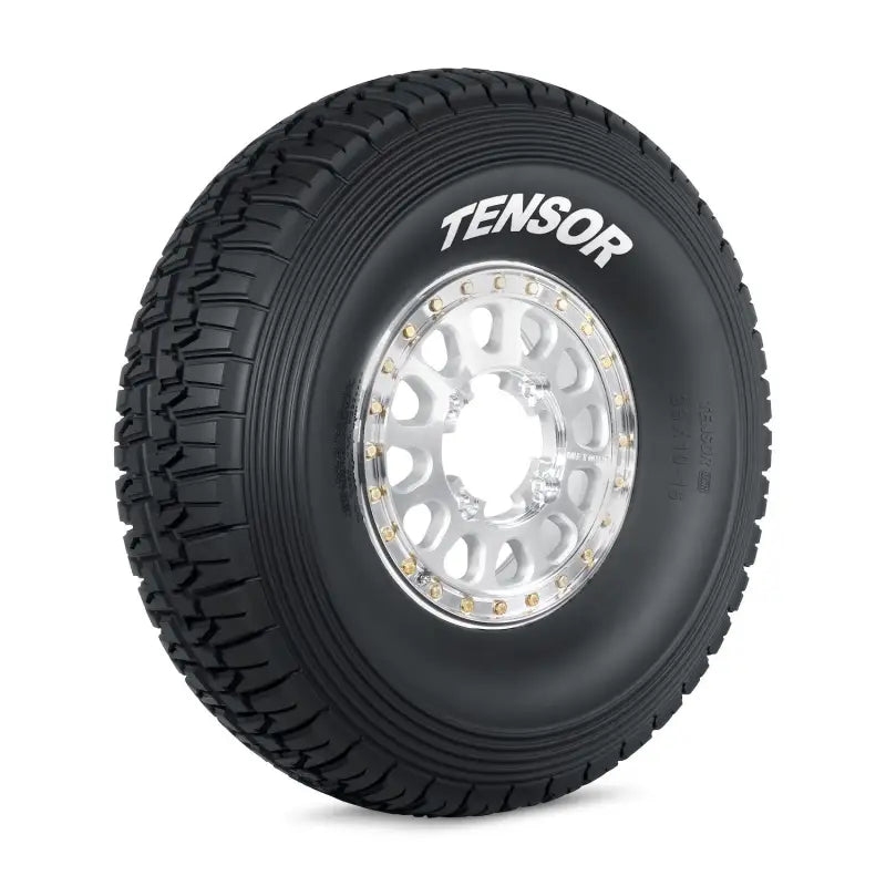 Black off-road tire with polished silver beadlock wheel from Tensor Tire Desert Series