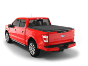Red Ford F-150 pickup truck with tonneau cover.