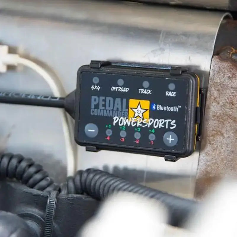 Black Pedal Commander Powersports throttle sensitivity booster for adjustable response control