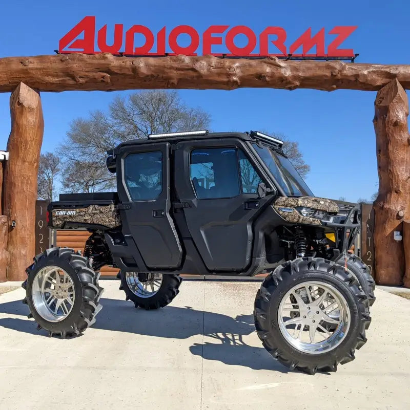 Lifted four-door all-terrain vehicle with Maxxis Tire ST235 80R16 for tough rides