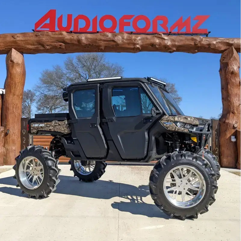Lifted four-door all-terrain vehicle with Maxxis Tire ST235 80R16 for tough rides