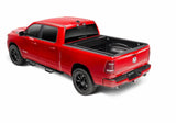 Red pickup truck with black matte Tonneau Cover Manual Retractable and Trax Rail System