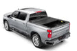 Silver pickup truck with matte black tonneau cover power retractable and lockable