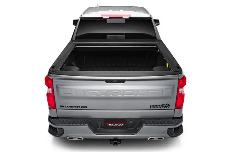 Silver pickup truck with matte black tonneau cover power retractable and lockable