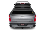 Silver pickup truck with matte black tonneau cover power retractable and lockable