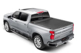 Silver pickup truck with matte black tonneau cover power retractable and lockable tips