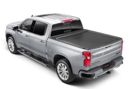 Silver pickup truck with matte black tonneau cover power retractable and lockable tips