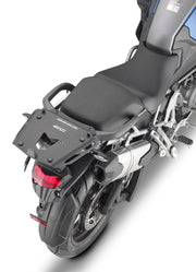 Motorcycle with rear luggage rack featuring Case Hardware Tri for secure storage