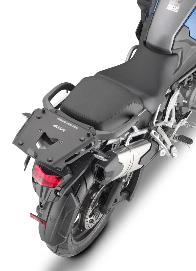 Motorcycle with rear luggage rack featuring Case Hardware Tri for secure storage