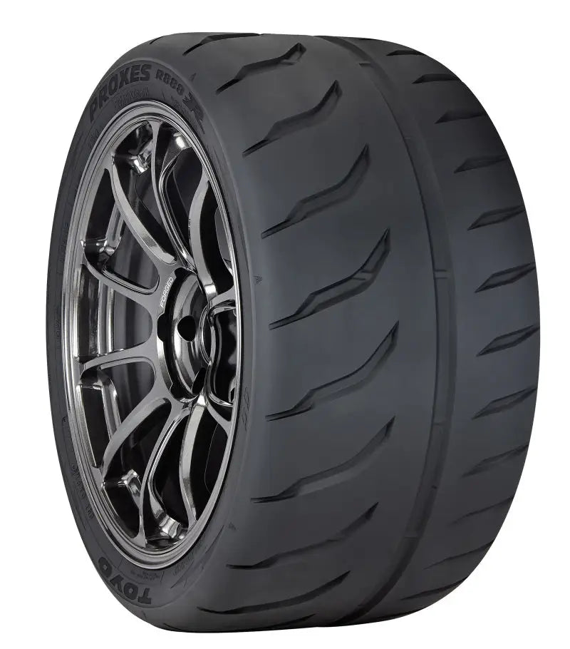 Black car tire with chrome rim showcasing Toyo Proxes R888R tire 225/45R13 84V