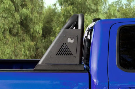 Blue pickup truck with black bed bar and roll bar mounted on open channel bed rail