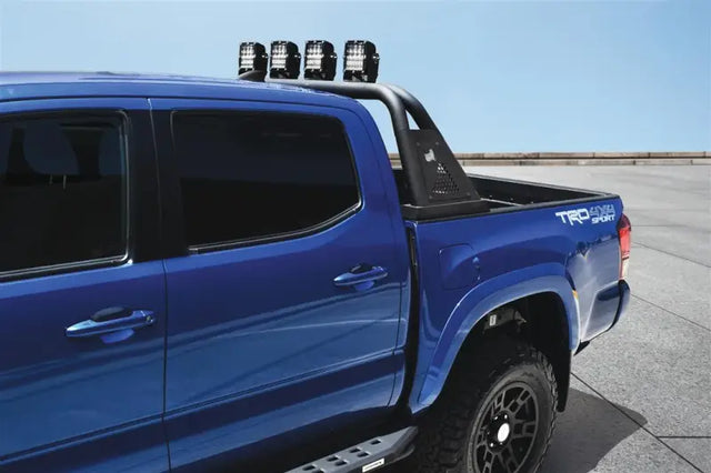 Blue pickup truck bed bar with lights, tubular style, black steel, open rail mount