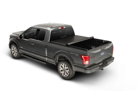 Gray Ford F-150 pickup with Truxport bed cover for added style and protection