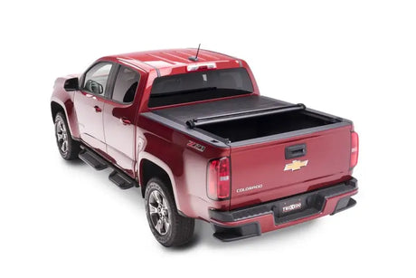 Maroon Chevrolet Colorado with Truxedo Pro Tonneau Cover on truck bed