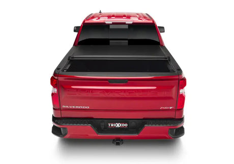 Red Chevrolet pickup with Truxedo Lo Pro bed cover, perfect pro tonneau cover for truck bed