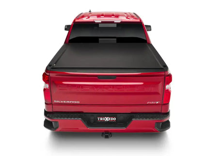 Red pickup truck with Truxedo Lo Pro bed cover showcasing a pro tonneau cover for truck bed