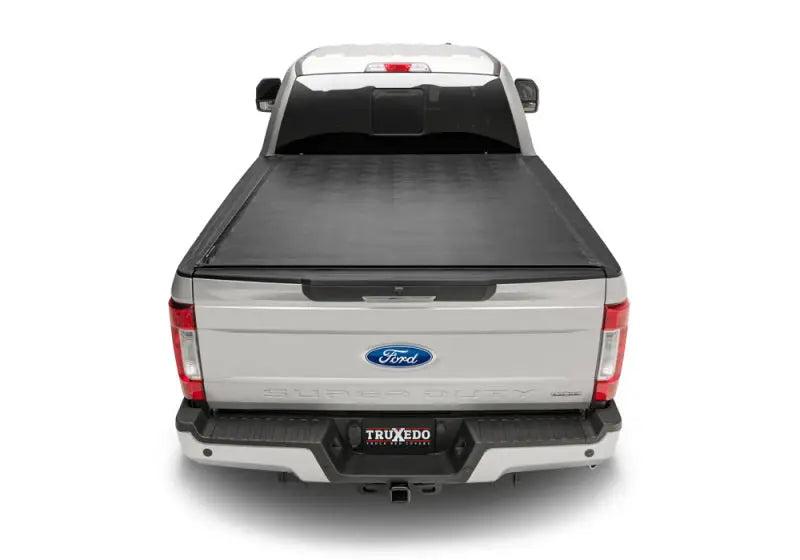 Silver pickup truck with black sentry tonneau cover made of durable vinyl fabric