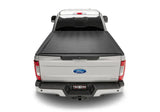 Silver pickup truck with black sentry tonneau cover made of durable vinyl fabric