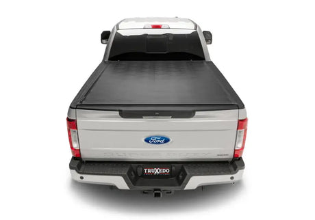 Silver pickup truck with black sentry tonneau cover made of durable vinyl fabric
