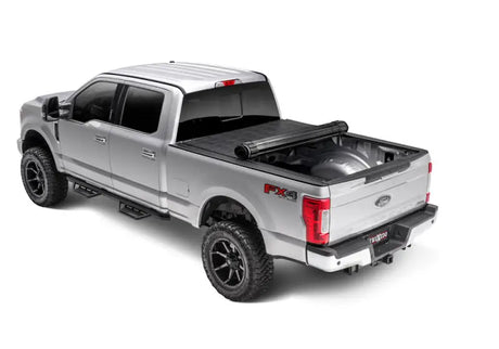 Silver Ford F-series with sentry tonneau cover and vinyl fabric bed cover