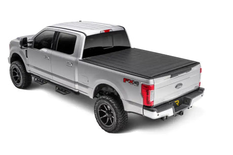 Silver Ford F-series pickup with black tonneau cover and running boards, Sentry tonneau cover in vinyl fabric