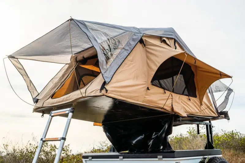 Tan and gray rooftop tent from Body Armor Trailhead Roof for 2 persons
