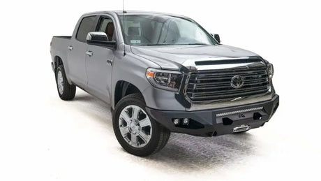 Silver Toyota Tundra pickup truck with Fab Fours front bumper in TT14-X3851-1 model