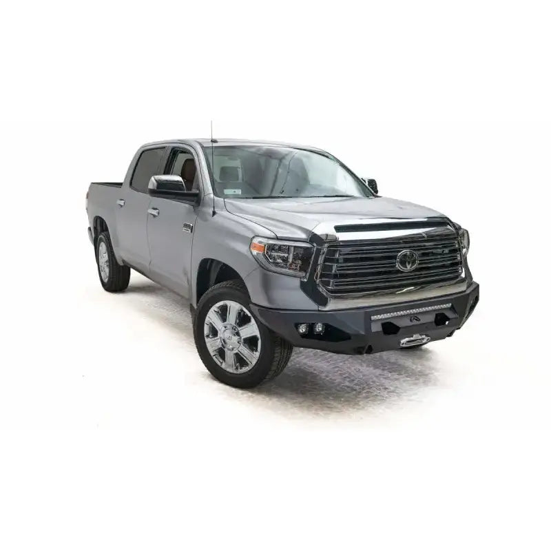 Silver Toyota Tundra pickup truck with Fab Fours front bumper in TT14-X3851-1 model