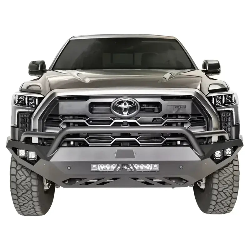 Front view of a truck equipped with the TT22-D5452-1 Fab Fours Vengeance Bumper, showcasing its robust construction and sleek design, RV, Automotive, Powersports, off-road, marine, exterior, truck accessories, interior, truck bed, rv parts, Bumpers, Grilles & Guards, AVADA - Best Sellers, Must Haves