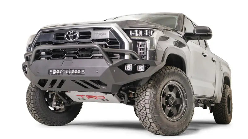 TT22-D5452-1 Fab Fours Vengeance Bumper installed on a rugged truck, showcasing robust construction and aggressive design, ideal for enhancing vehicle protection and style. Perfect for RV, Automotive, Powersports, off-road, marine, exterior, truck accessories, interior, truck bed, RV parts, Bumpers, Grilles & Guards, AVADA - Best Sellers, Must Haves