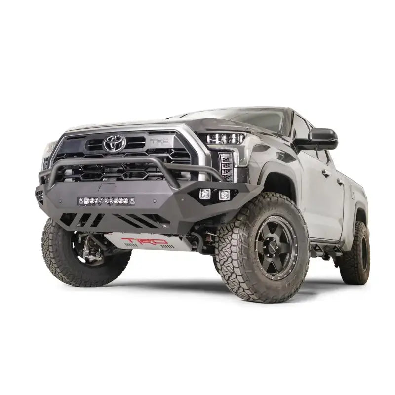 TT22-D5452-1 Fab Fours Vengeance Bumper installed on a rugged truck, showcasing robust construction and aggressive design, ideal for enhancing vehicle protection and style. Perfect for RV, Automotive, Powersports, off-road, marine, exterior, truck accessories, interior, truck bed, RV parts, Bumpers, Grilles & Guards, AVADA - Best Sellers, Must Haves