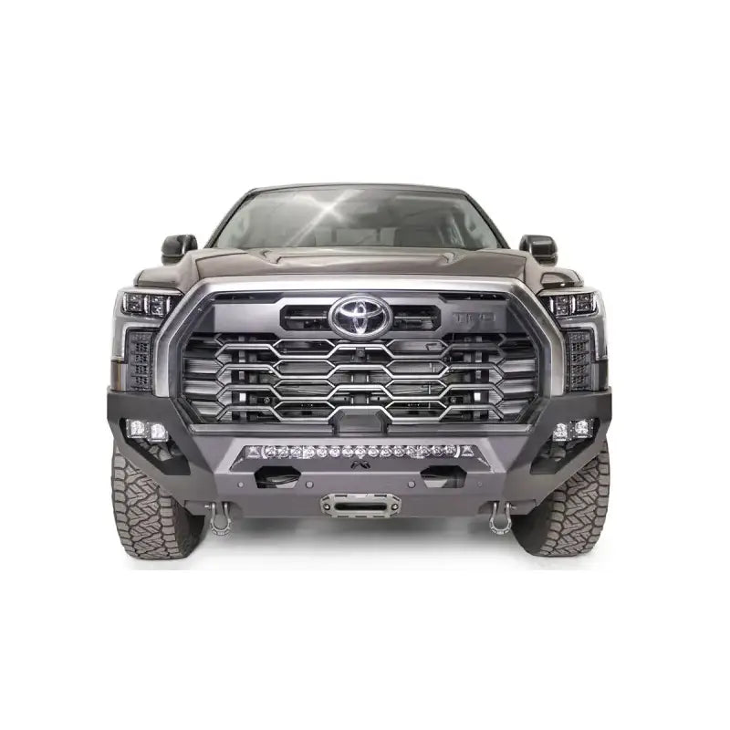Front view of a Toyota truck equipped with the TT22-X5451-1 Fab Fours Matrix Bumper featuring superior protection, durable construction, and sleek design.