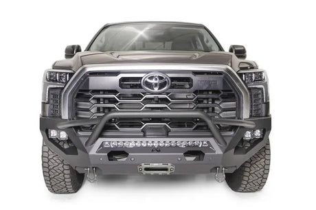 Front view of a Toyota truck equipped with the TT22-X5452-1 Fab Fours Matrix Bumper, showcasing rugged design and premium engineering, ideal for off-road protection and style enhancement.