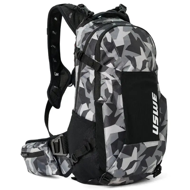 Gray and black camouflage USWE Shred MTB Daypack 16L with adjustable straps and compartments