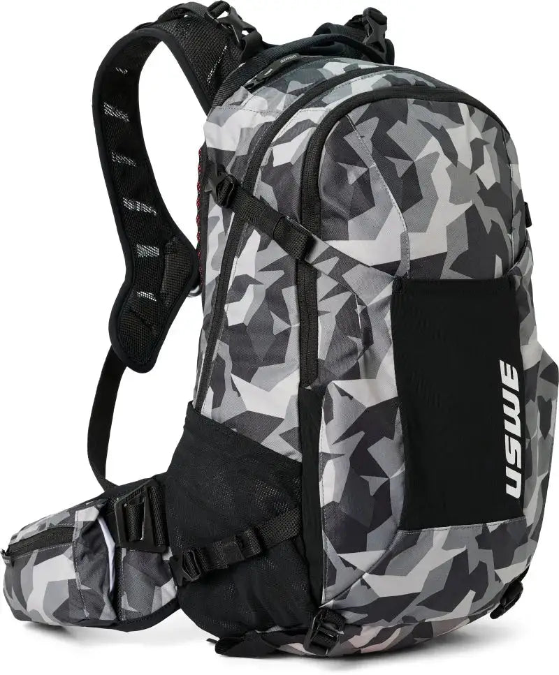 USWE Shred MTB daypack with camo black design, padded straps, and waist belt