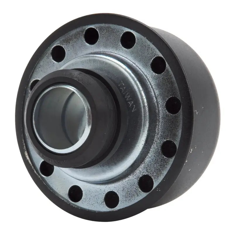 Black and silver valve cover breather with circular holes for engine venting