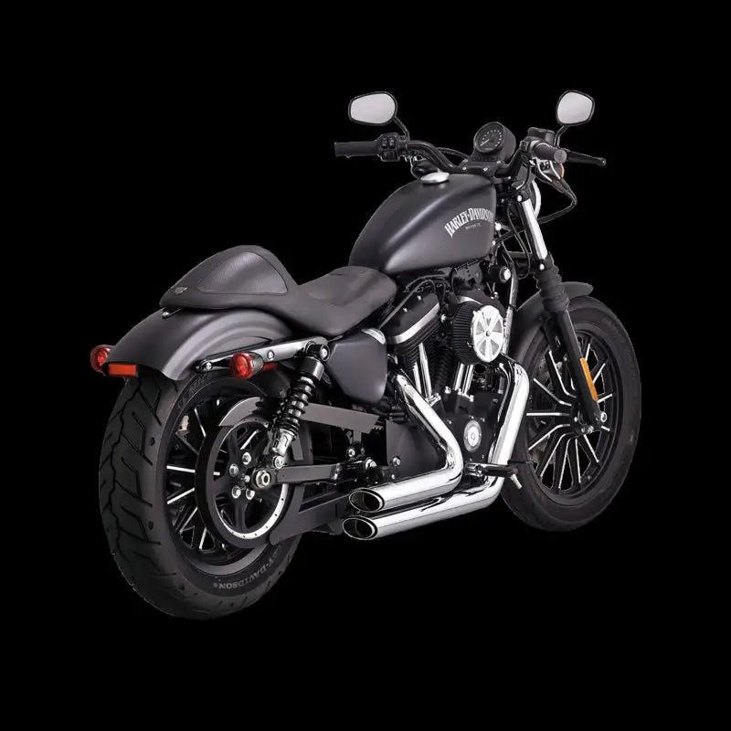 Vance and Hines Shortshots Stagg Pcx Chr exhaust on a sleek black Harley-Davidson motorcycle.